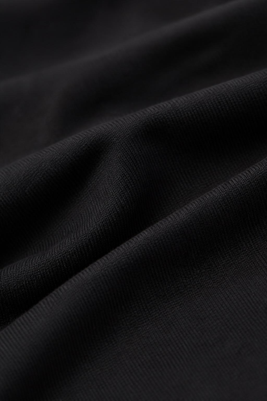 Detalhe macro do tecido pima preto BLVCK & WHTE